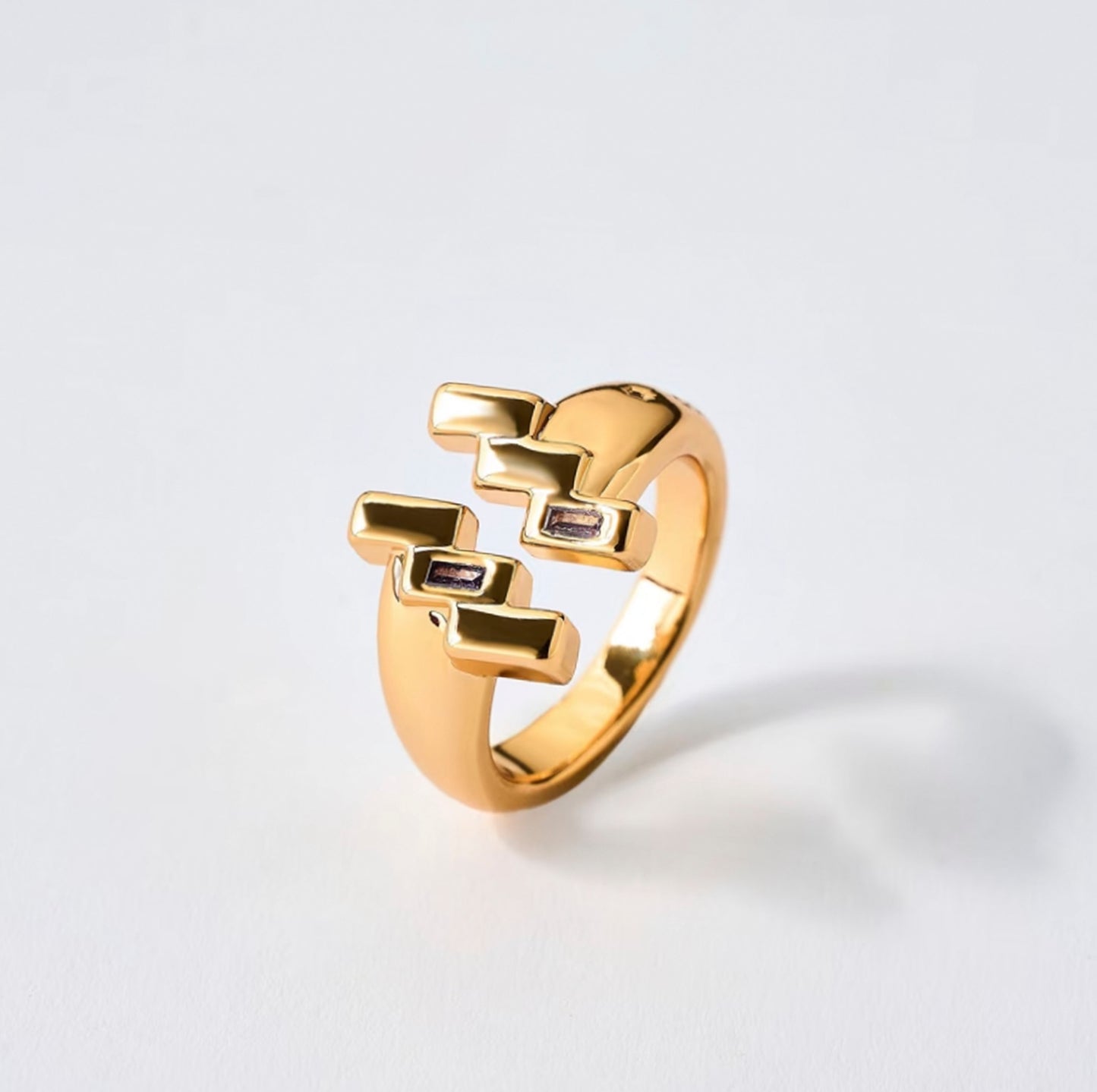 Gold Aquarius ring with tanzanite zircon by QiBai London