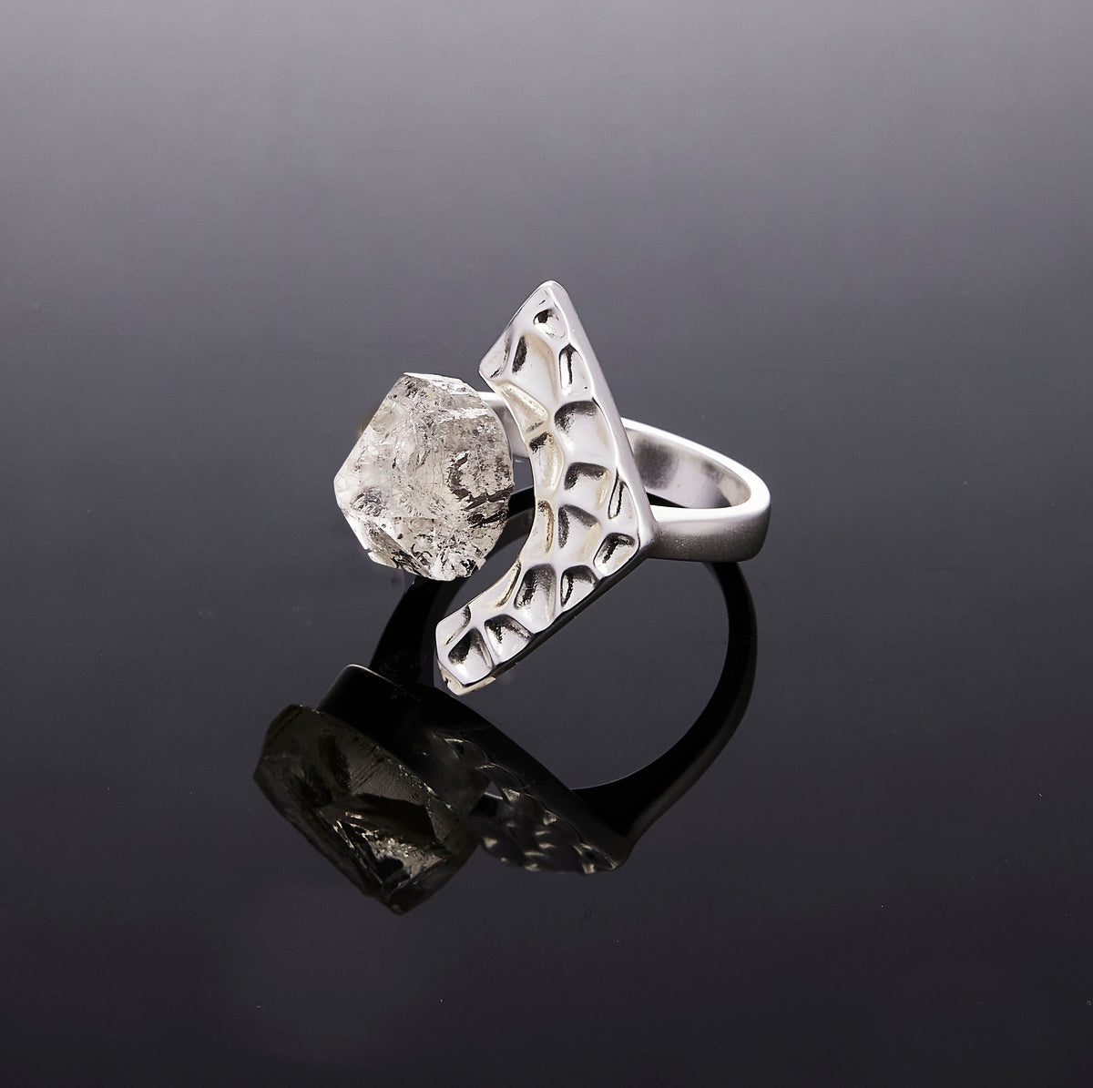 Silver Echo Gate crystal ring on a reflective black background by QiBai London