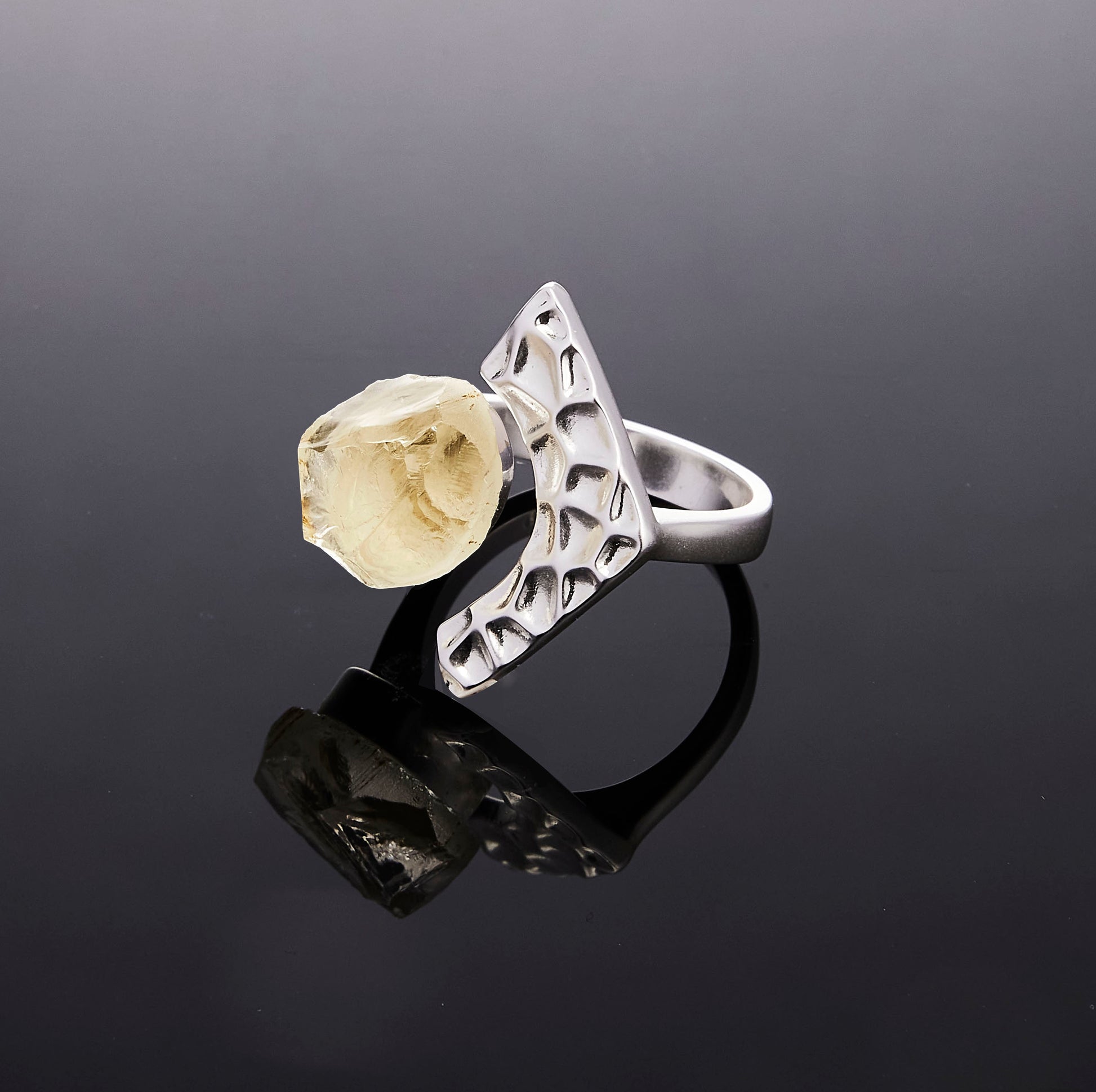 Silver Tectonic Bloom ring with raw Citrine crystal on black background by QiBai London